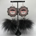 Uluk with black fox fur pompom’s earrings made by me